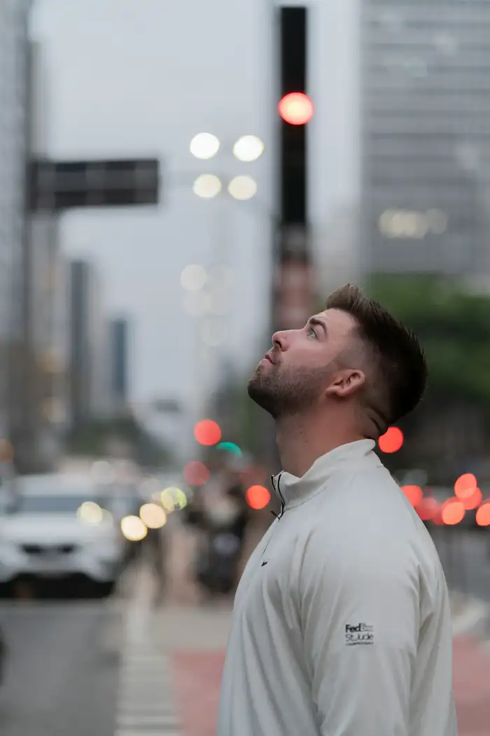 A man standing calm in a busy street