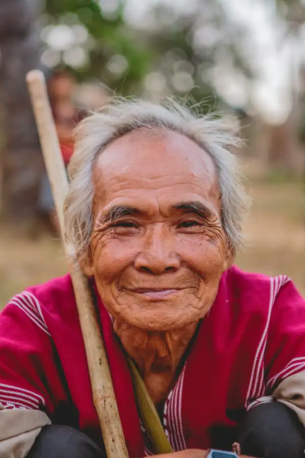An elderly man smiling