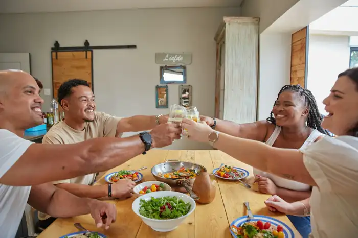 Friends toasting at a dinner table
